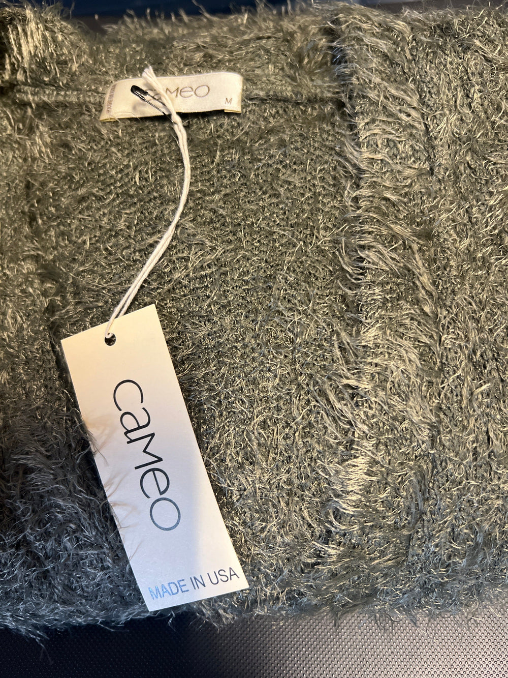 Cameo Clothing Line Bay Cardi sweater in navy, featuring a cozy knit design with a V-neck and ribbed cuffs.