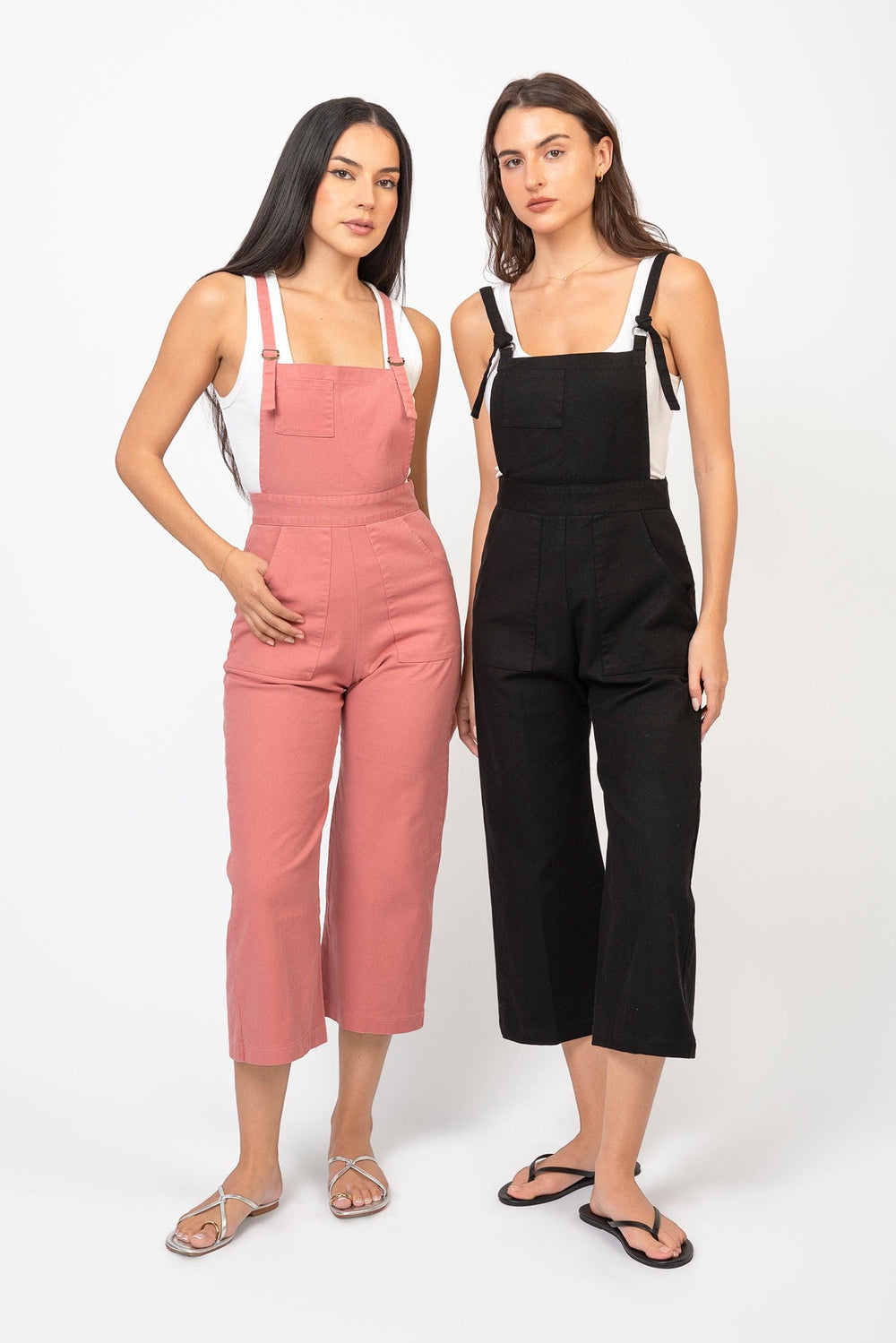 Cameo Clothing Line cropped denim overalls with adjustable straps and front pockets, styled with rolled cuffs.