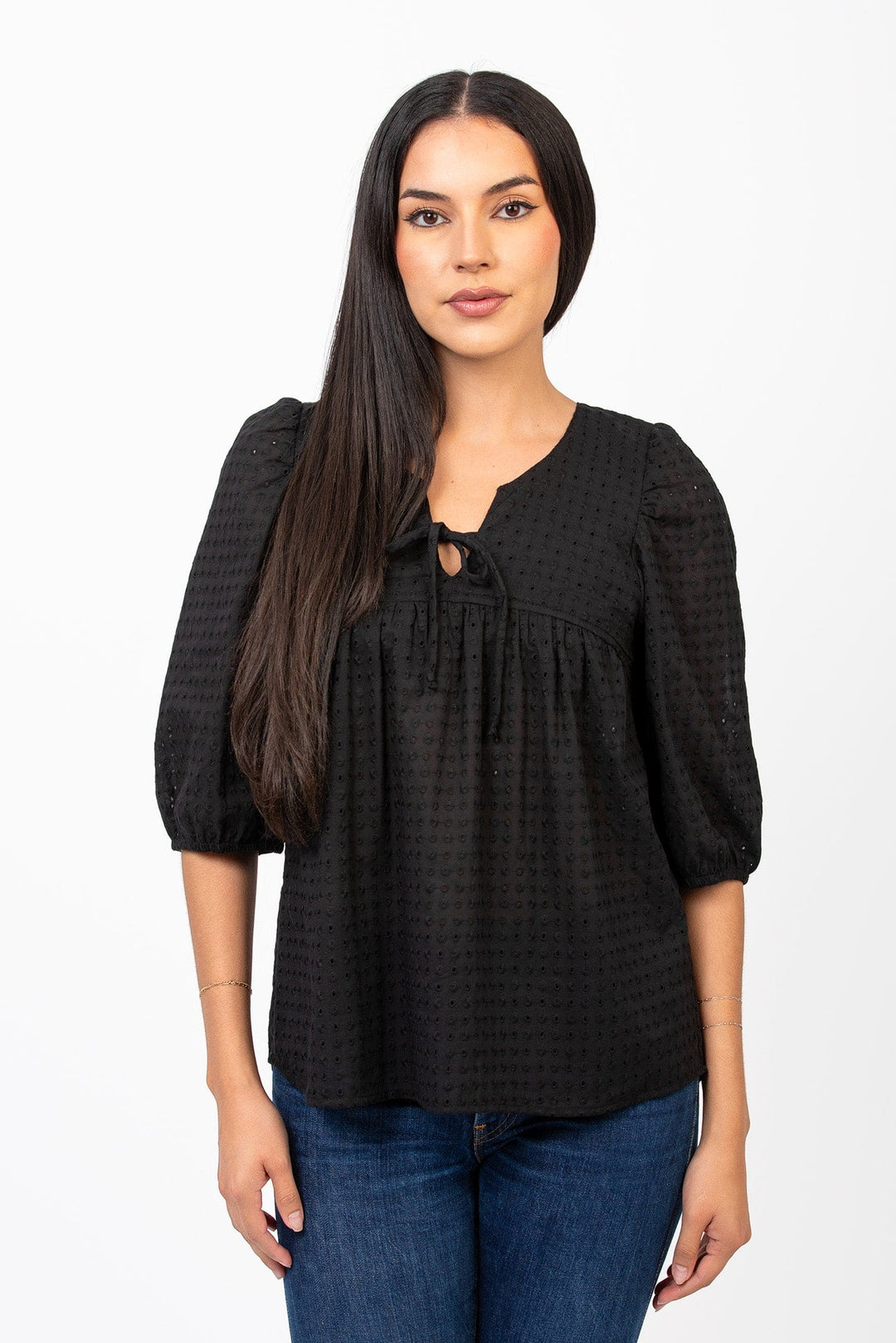 Cameo Clothing Line Betty blouse, stylish women's shirt with a relaxed fit and floral pattern, displayed on a hanger.