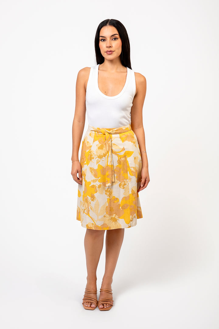Knee-length wrap skirt by Cameo Clothing Line in linen and rayon with a floral pattern, displayed in a wide photo.